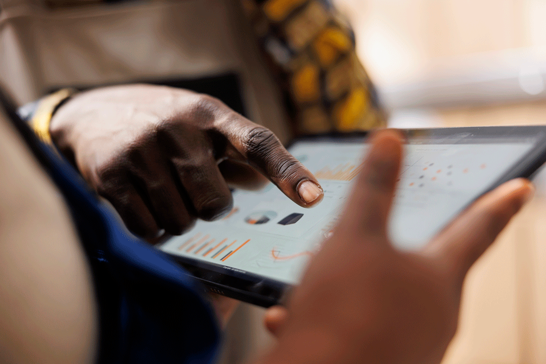 warehouse-worker-hand-pointing-inventory-statistics-tablet